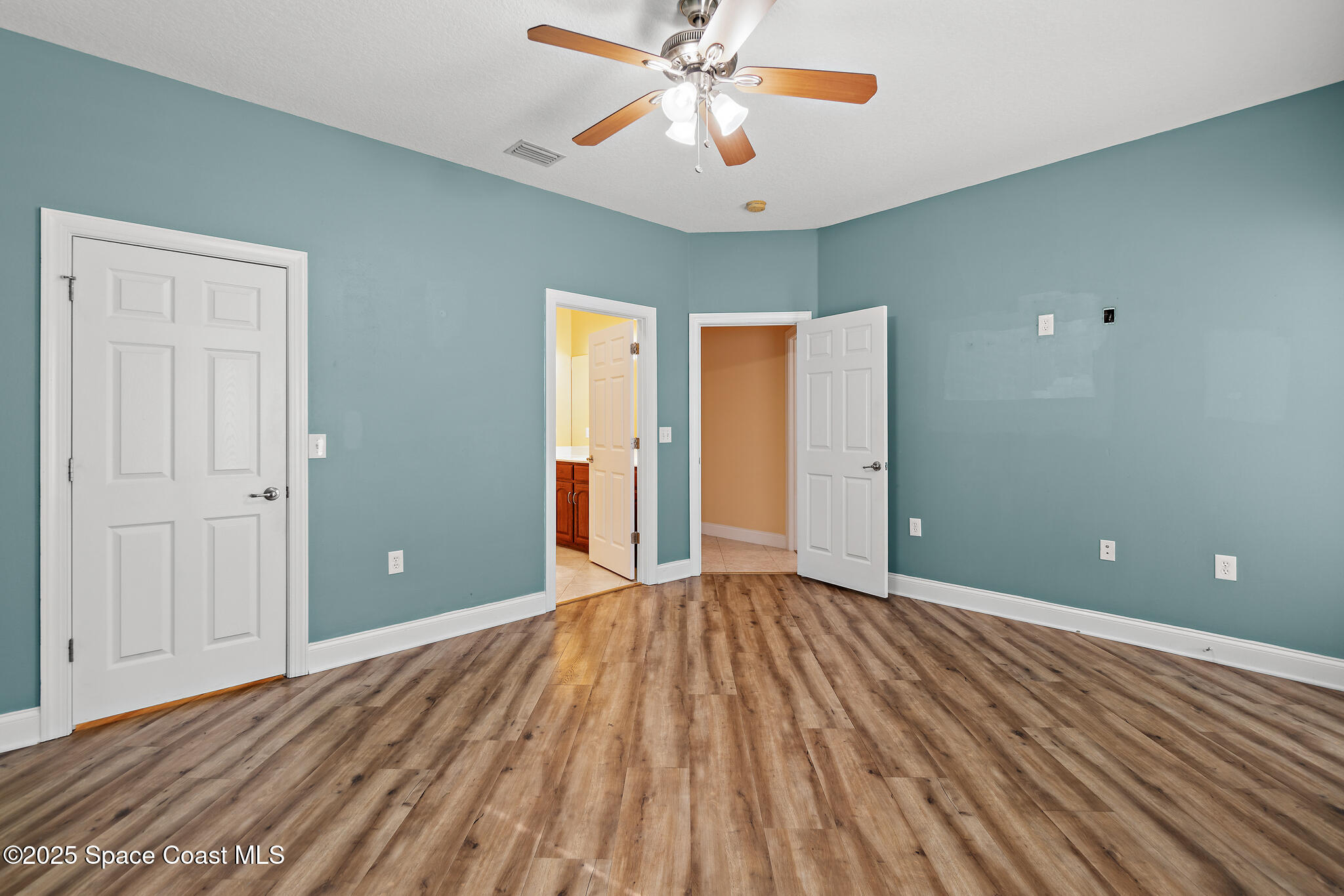 131 Harding Avenue, Unit 131 & 129 Cocoa Beach, FL 32931 - Photo 15 of 47 a view of an empty room with window and a kitchen