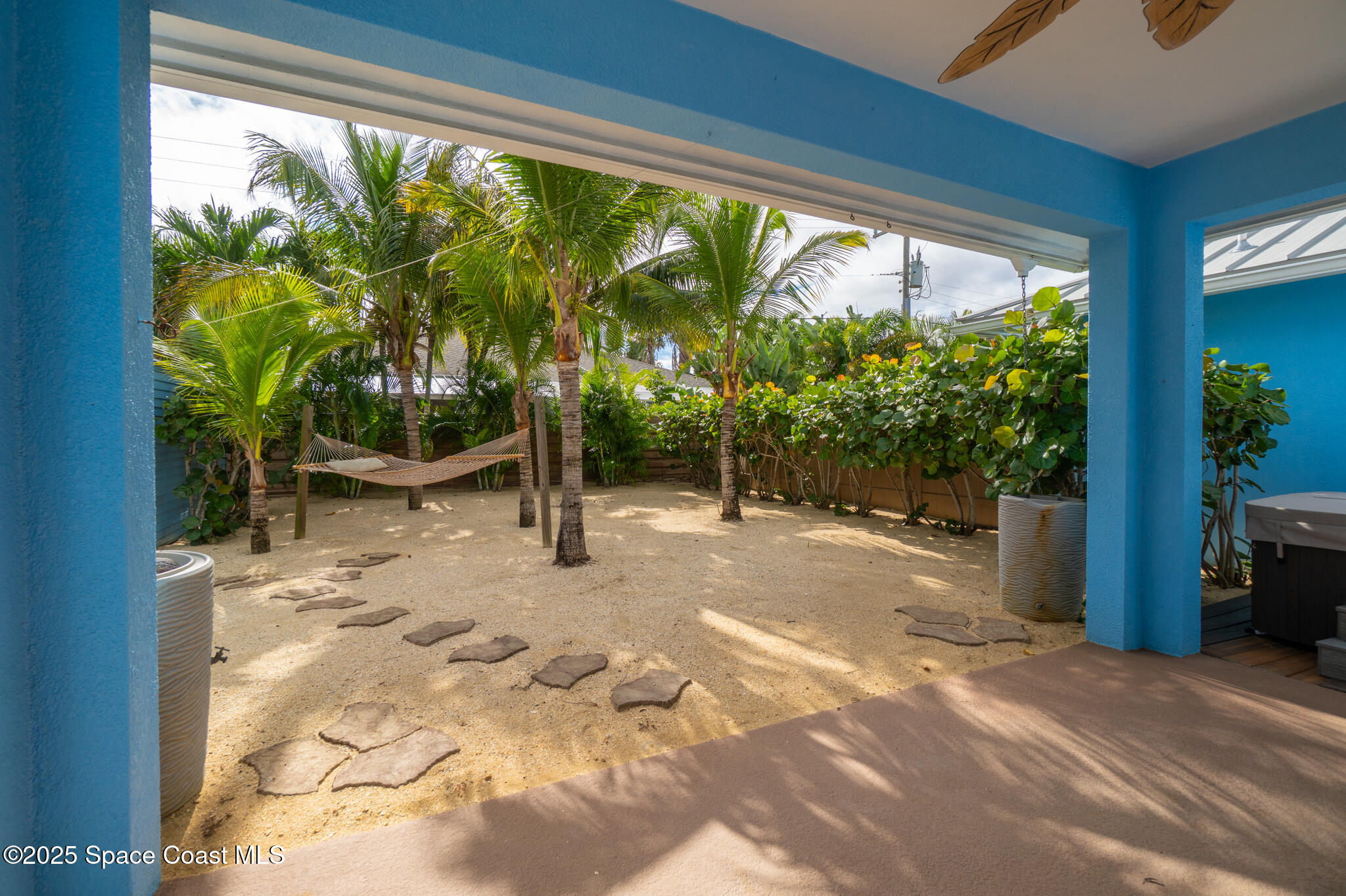131 Harding Avenue, Unit 131 & 129 Cocoa Beach, FL 32931 - Photo 20 of 47 a view of backyard with plants and outdoor seating