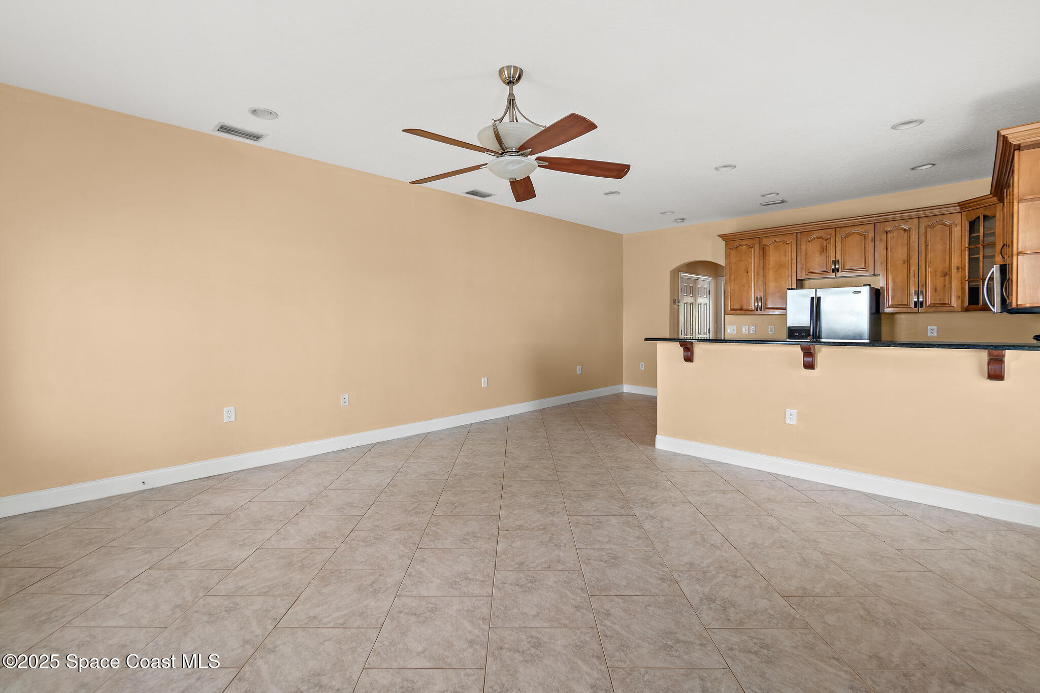 131 Harding Avenue, Unit 131 & 129 Cocoa Beach, FL 32931 - Photo 30 of 47 a view of a kitchen with a sink and cabinets