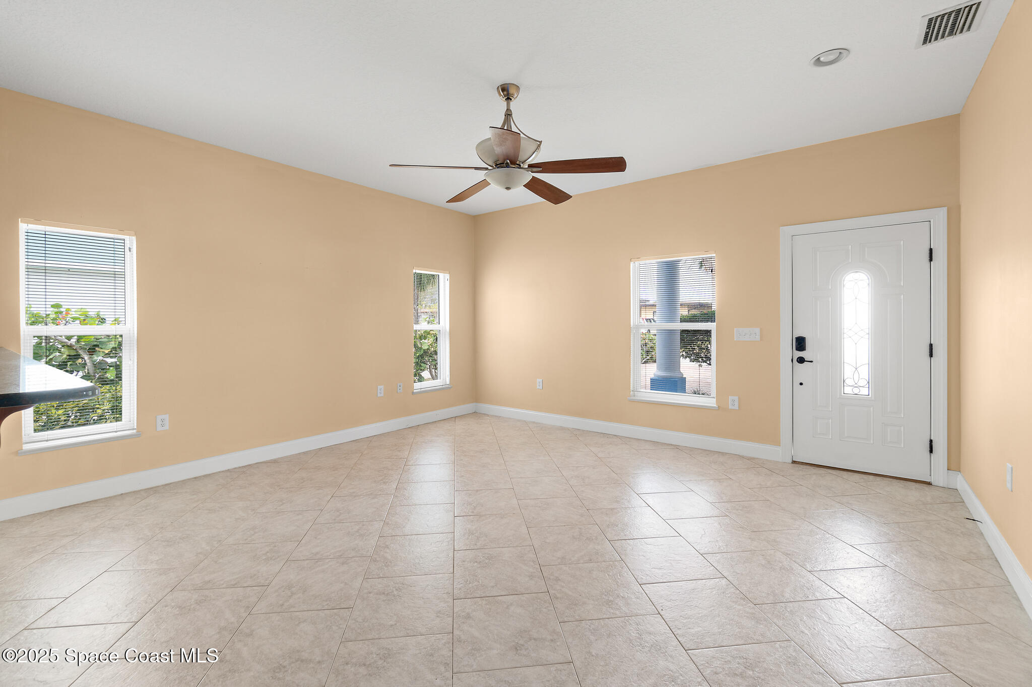 131 Harding Avenue, Unit 131 & 129 Cocoa Beach, FL 32931 - Photo 46 of 47 a view of an empty room with a window