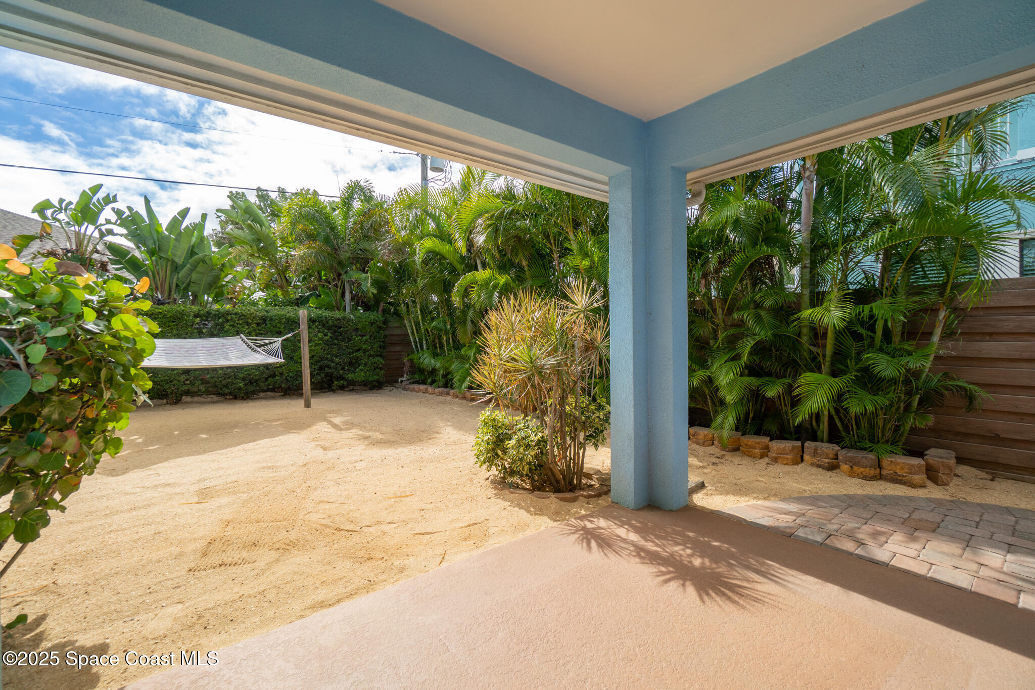 131 Harding Avenue, Unit 131 & 129 Cocoa Beach, FL 32931 - Photo 31 of 47 a view of backyard with large tree