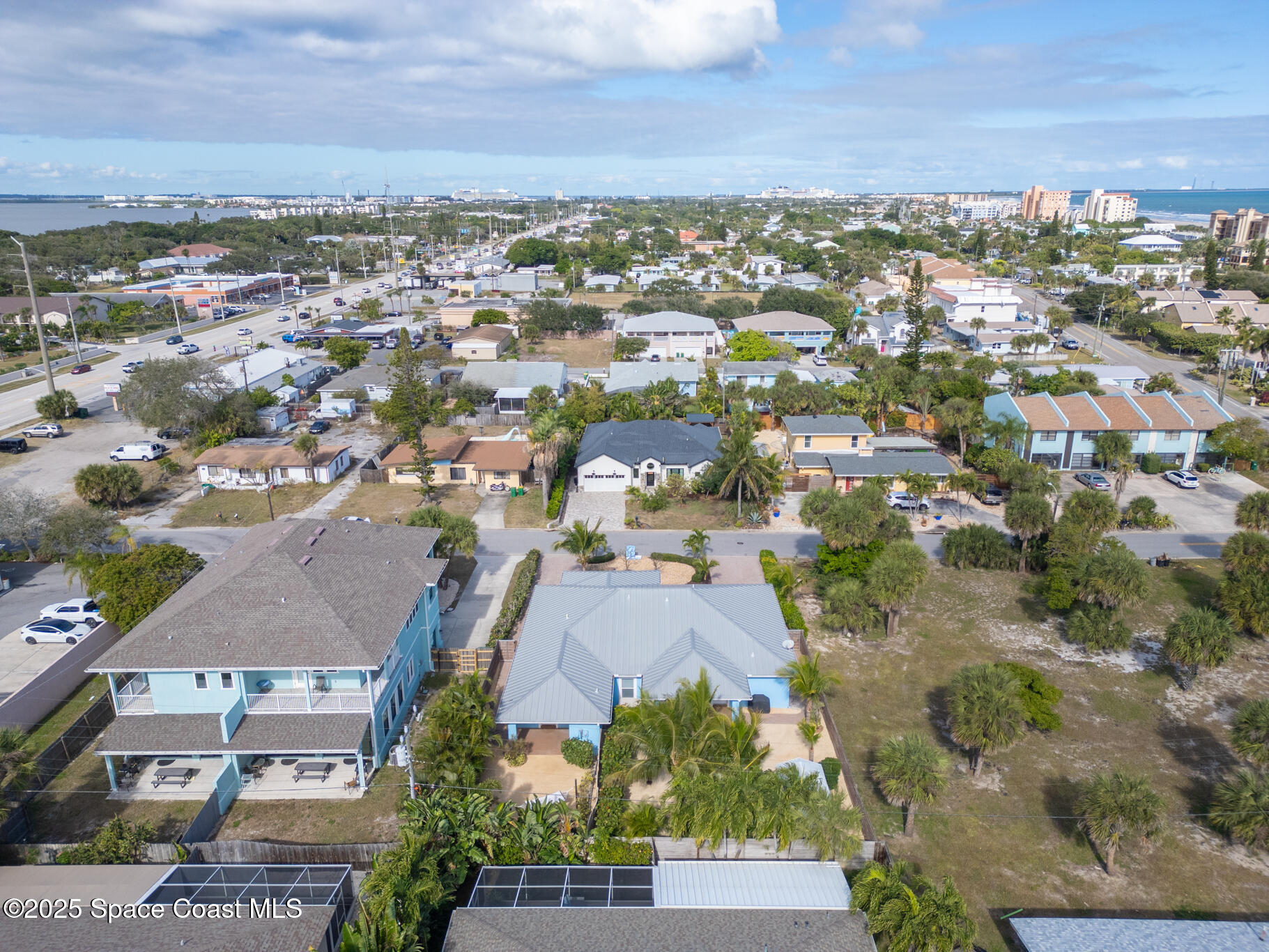 131 Harding Avenue, Unit 131 & 129 Cocoa Beach, FL 32931 - Photo 35 of 47 an aerial view of residential houses with outdoor space
