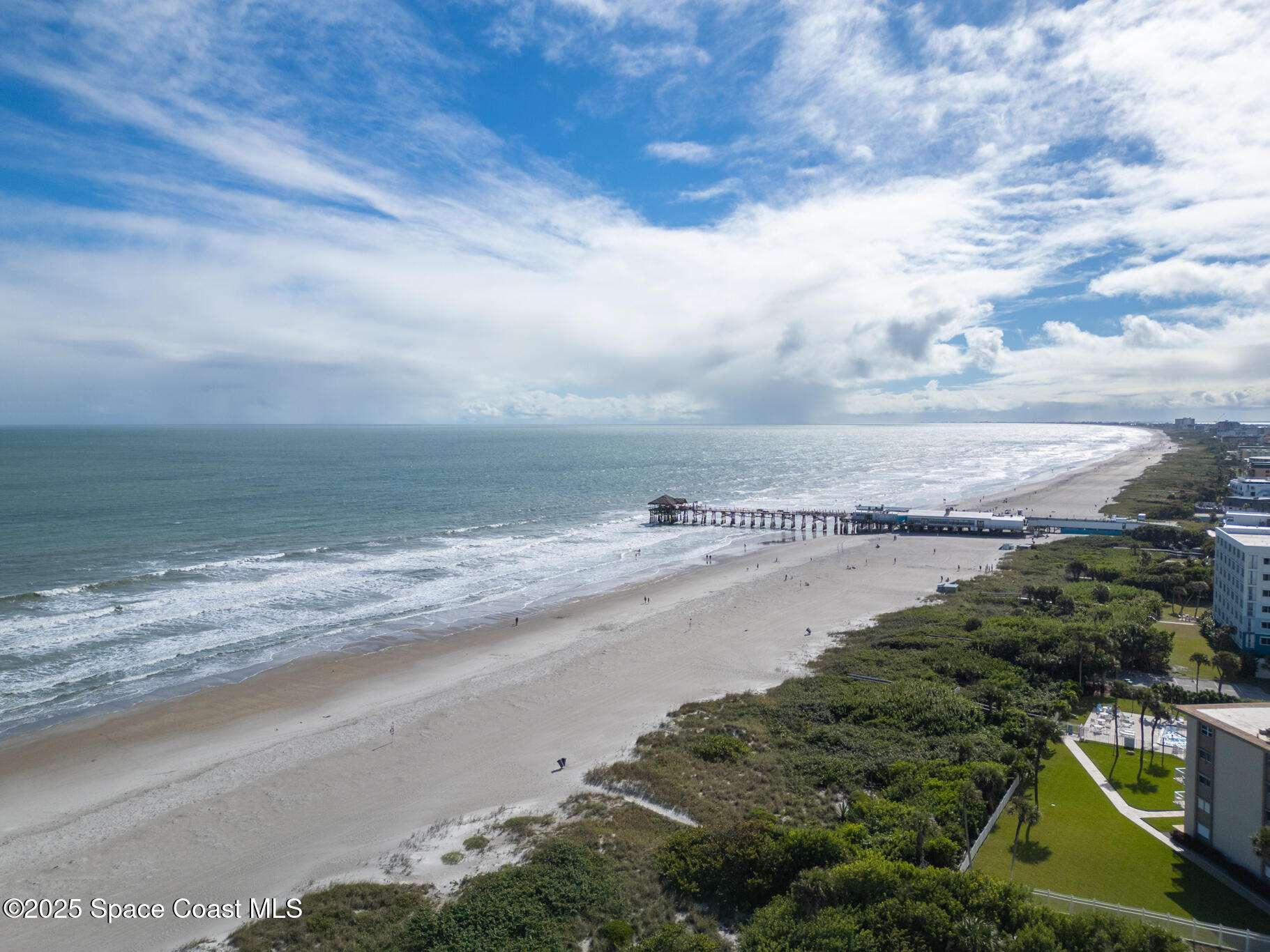 131 Harding Avenue, Unit 131 & 129 Cocoa Beach, FL 32931 - Photo 40 of 47 a view of an ocean beach
