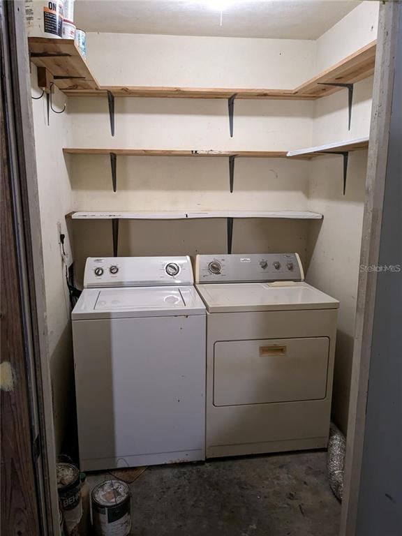4317 Southwest 69 Terrace Gainesville, FL 32608 - Photo 11 of 23 a utility room with dryer and washer