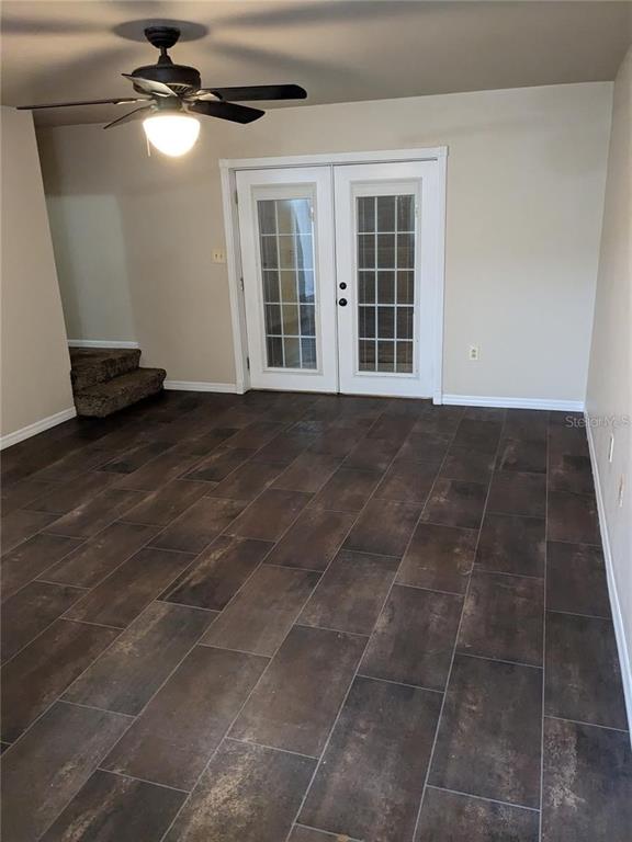 4317 Southwest 69 Terrace Gainesville, FL 32608 - Photo 6 of 23 a view of an empty room with a window