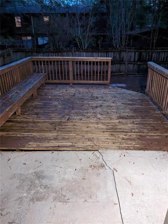 4317 Southwest 69 Terrace Gainesville, FL 32608 - Photo 8 of 23 a view of deck with wooden floor and outdoor seating