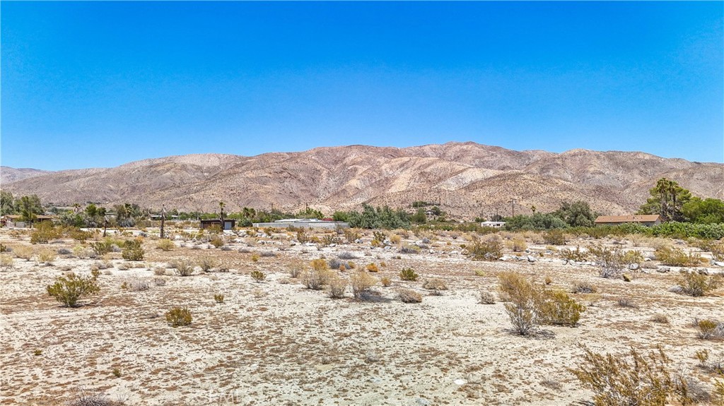 5 Dillon Road Desert Hot Springs, CA 92241 - Photo 15 of 25 a view of a field with mountains in the background