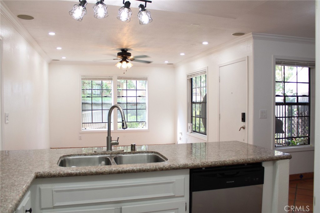 1052 Calle Del Cerro, Unit 701 San Clemente, CA 92672 - Photo 14 of 14 a kitchen with granite countertop a sink and a window