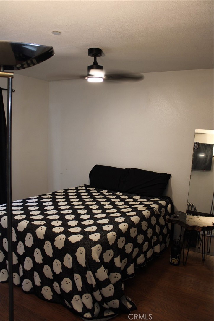 1052 Calle Del Cerro, Unit 701 San Clemente, CA 92672 - Photo 6 of 14 a bedroom with a bed and a night stand