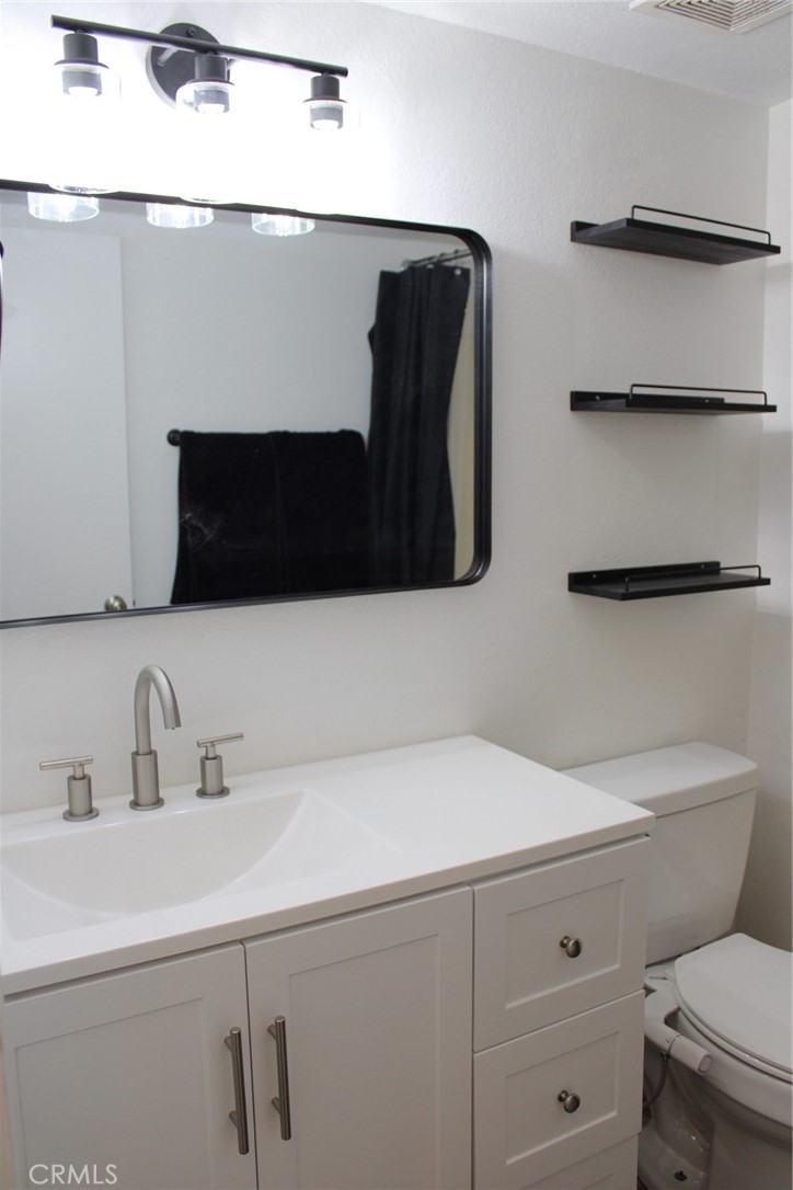 1052 Calle Del Cerro, Unit 701 San Clemente, CA 92672 - Photo 9 of 14 a bathroom with a sink and a toilet