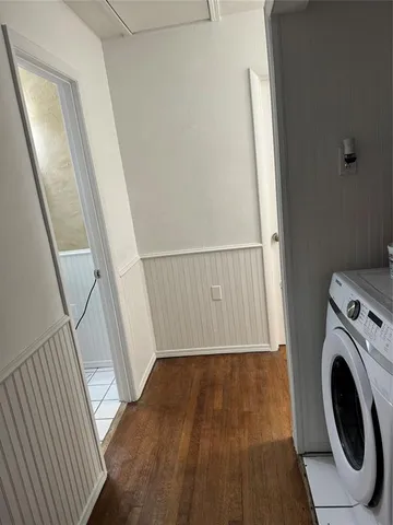 a view of a hallway with washer and dryer