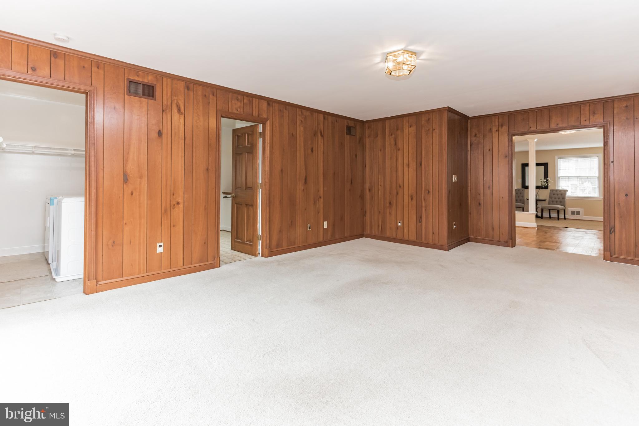2803 Cameron Mills Road Alexandria, VA 22302 - Photo 15 of 32 great room with doors to laundry and full bathroom