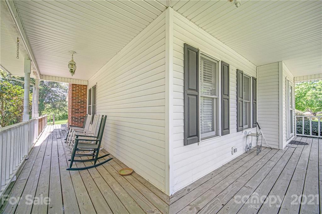 485 Mt Tabor Road Cleveland, NC 27013 - Photo 2 of 28 a view of a wooden chairs on the deck