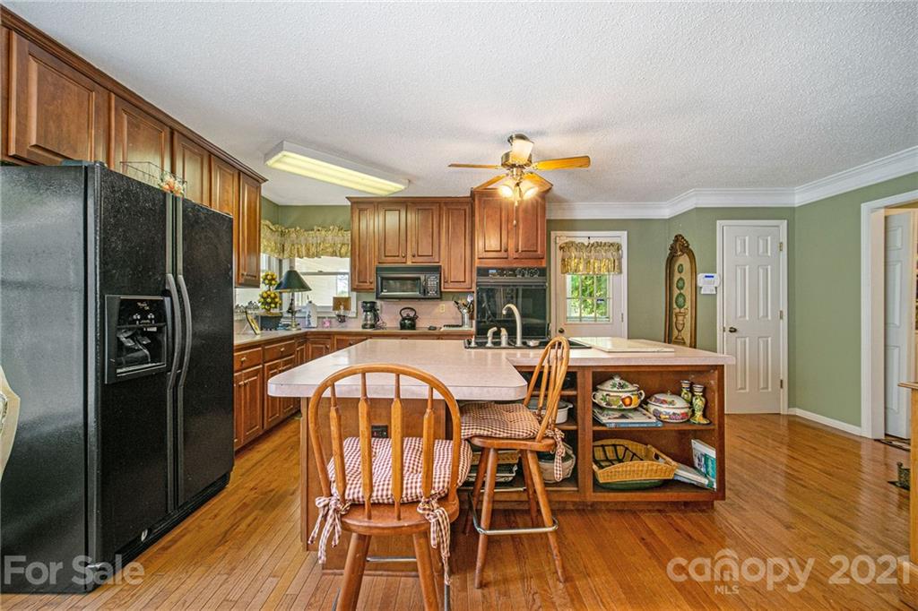 485 Mt Tabor Road Cleveland, NC 27013 - Photo 15 of 28 a view of a dining room with furniture and wooden floor