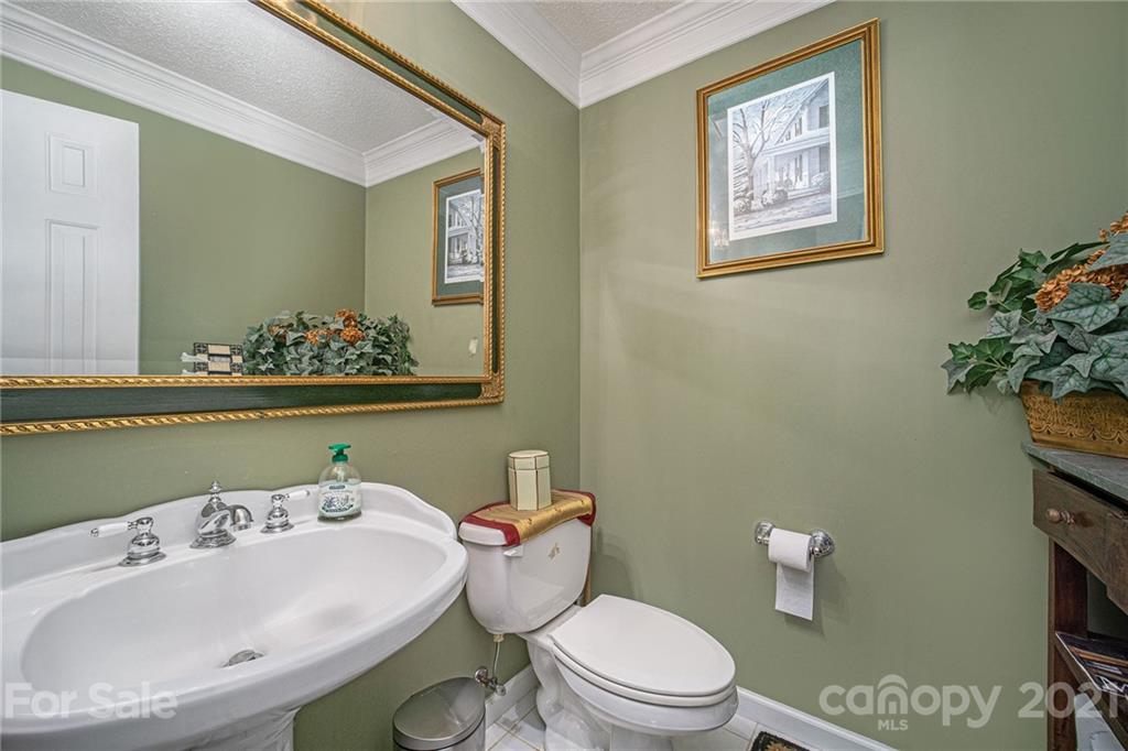 485 Mt Tabor Road Cleveland, NC 27013 - Photo 18 of 28 a bathroom with a sink mirror and toilet