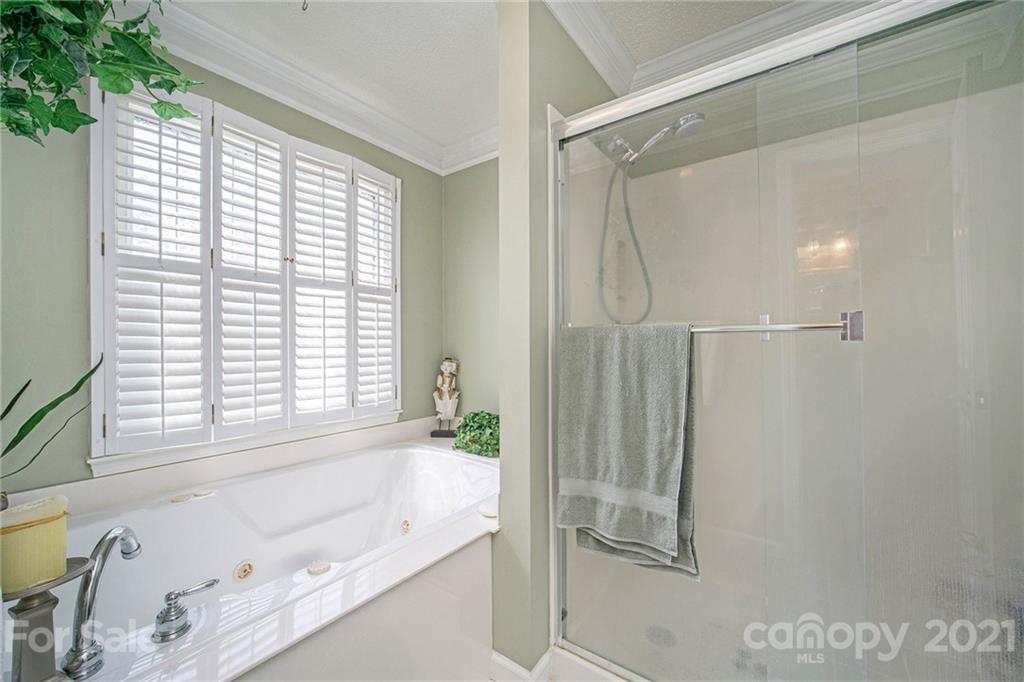 485 Mt Tabor Road Cleveland, NC 27013 - Photo 22 of 28 a bathroom with a bathtub and a shower