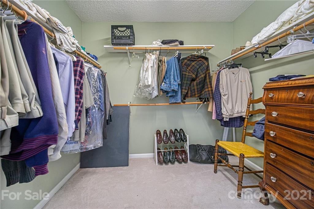 485 Mt Tabor Road Cleveland, NC 27013 - Photo 23 of 28 a view of walk in closet with clothes and shoes