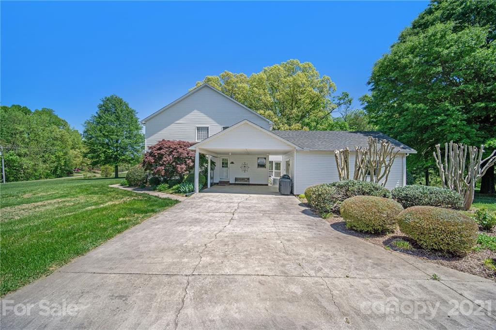 485 Mt Tabor Road Cleveland, NC 27013 - Photo 4 of 28 a front view of a house with garden and trees