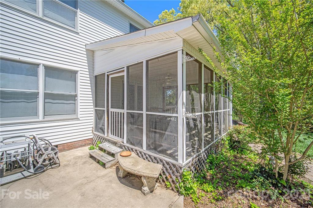 485 Mt Tabor Road Cleveland, NC 27013 - Photo 6 of 28 a view of a chair and table in the back yard