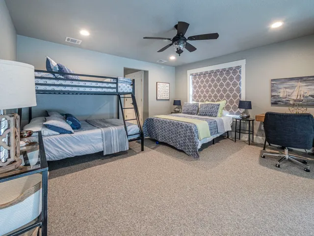 a bed room with a bed and a chandelier