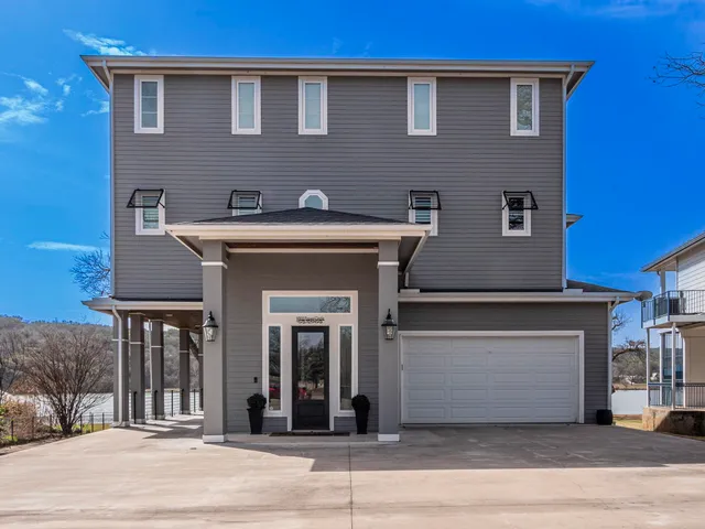 a front view of a house with a garage