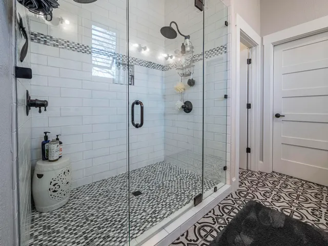 a living room with furniture fireplace and a large window