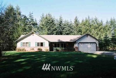 5306 133rd Avenue Southwest Rochester, WA 98579 - Photo 1 of 1 a front view of a house with a garden