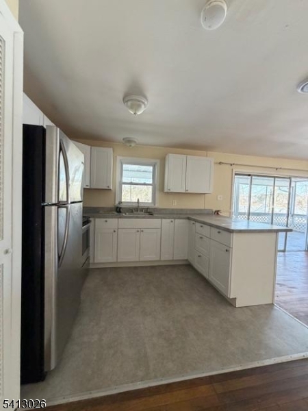 113 D North Shore Point Montague, NJ 07827 - Photo 7 of 18 a kitchen with stainless steel appliances a refrigerator sink and cabinets