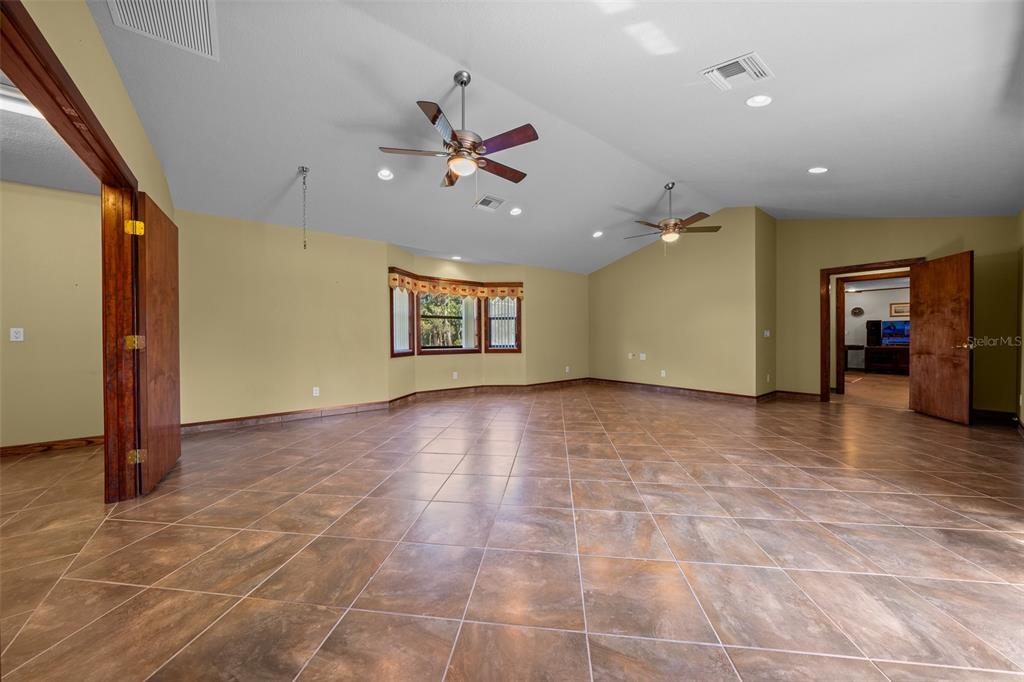 5950 Southwest 21st Avenue Road Ocala, FL 34471 - Photo 17 of 79 a view of a livingroom with a ceiling fan and window