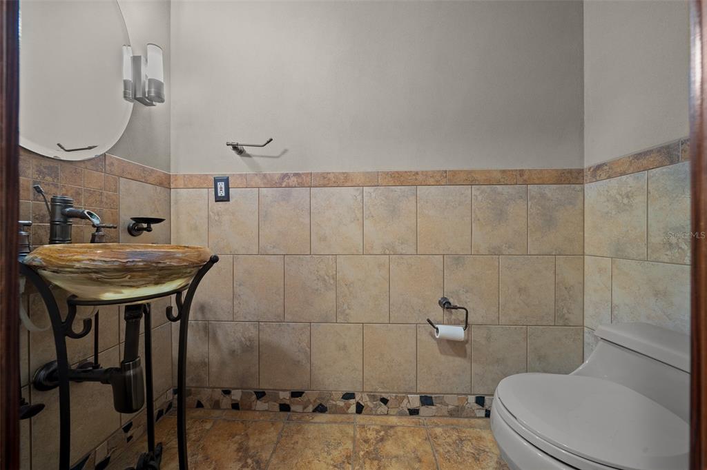 5950 Southwest 21st Avenue Road Ocala, FL 34471 - Photo 40 of 79 a bathroom with a sink a toilet and shower