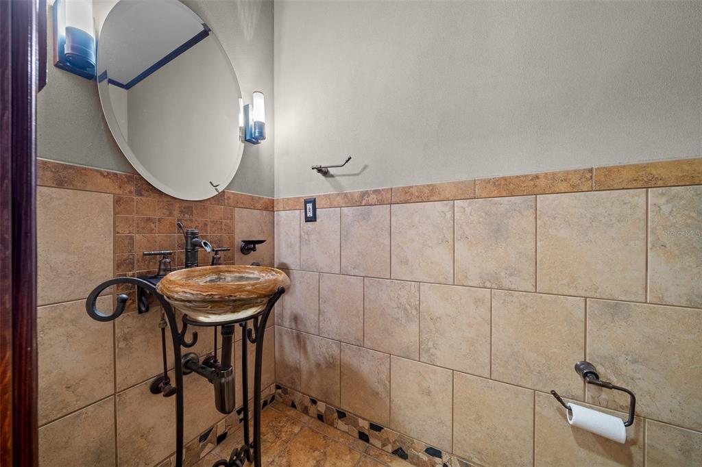 5950 Southwest 21st Avenue Road Ocala, FL 34471 - Photo 41 of 79 a bathroom with a sink and mirror