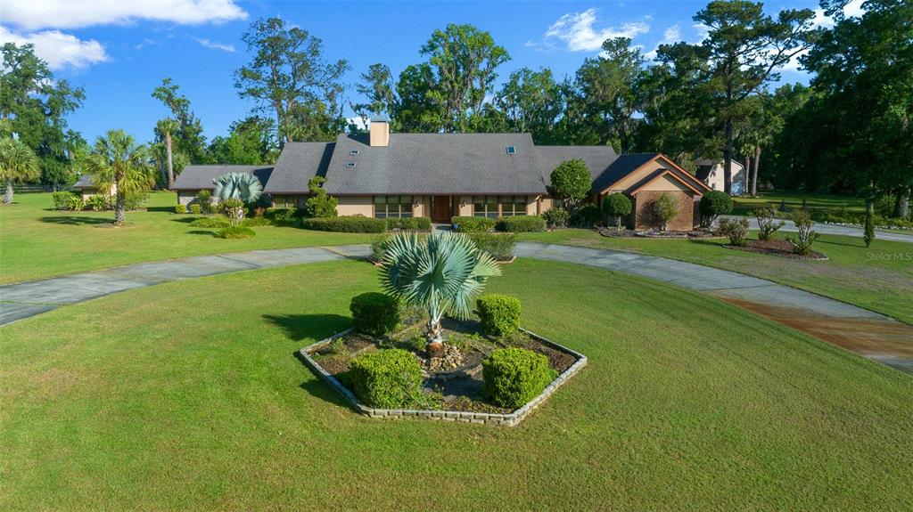 5950 Southwest 21st Avenue Road Ocala, FL 34471 - Photo 49 of 79 a house view with a garden space