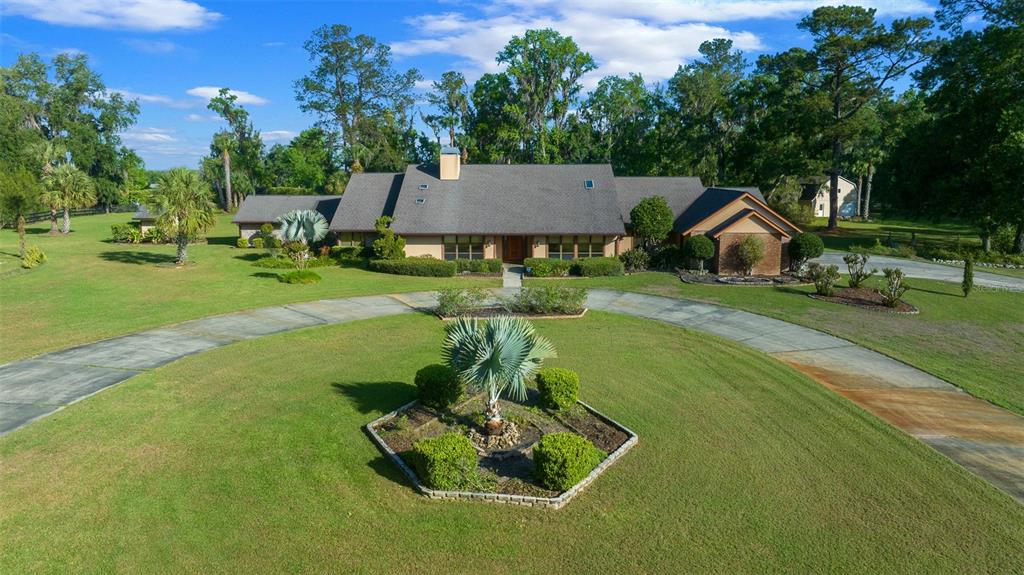 5950 Southwest 21st Avenue Road Ocala, FL 34471 - Photo 50 of 79 a view of a house with a swimming pool