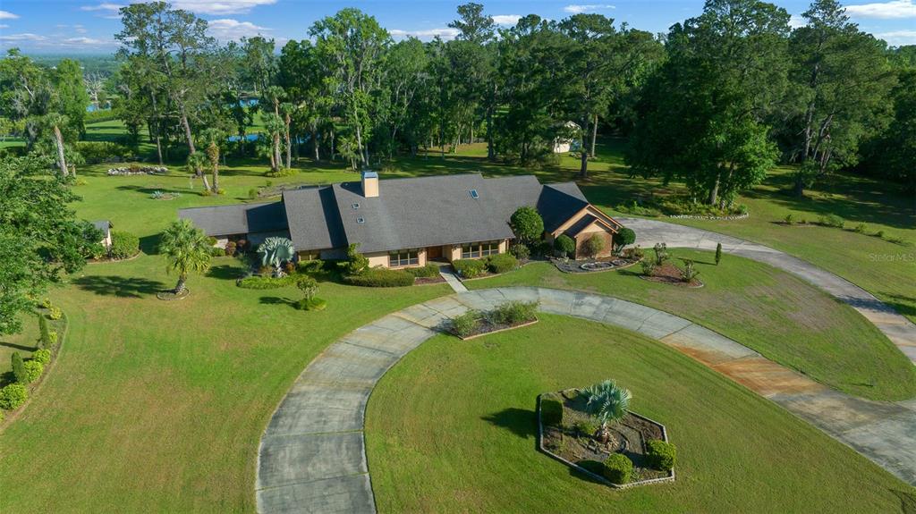 5950 Southwest 21st Avenue Road Ocala, FL 34471 - Photo 52 of 79 aerial view of a house with a swimming pool