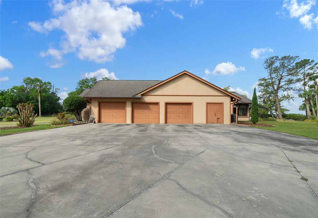 5950 Southwest 21st Avenue Road Ocala, FL 34471 - Photo 58 of 79 a view of a house with a yard