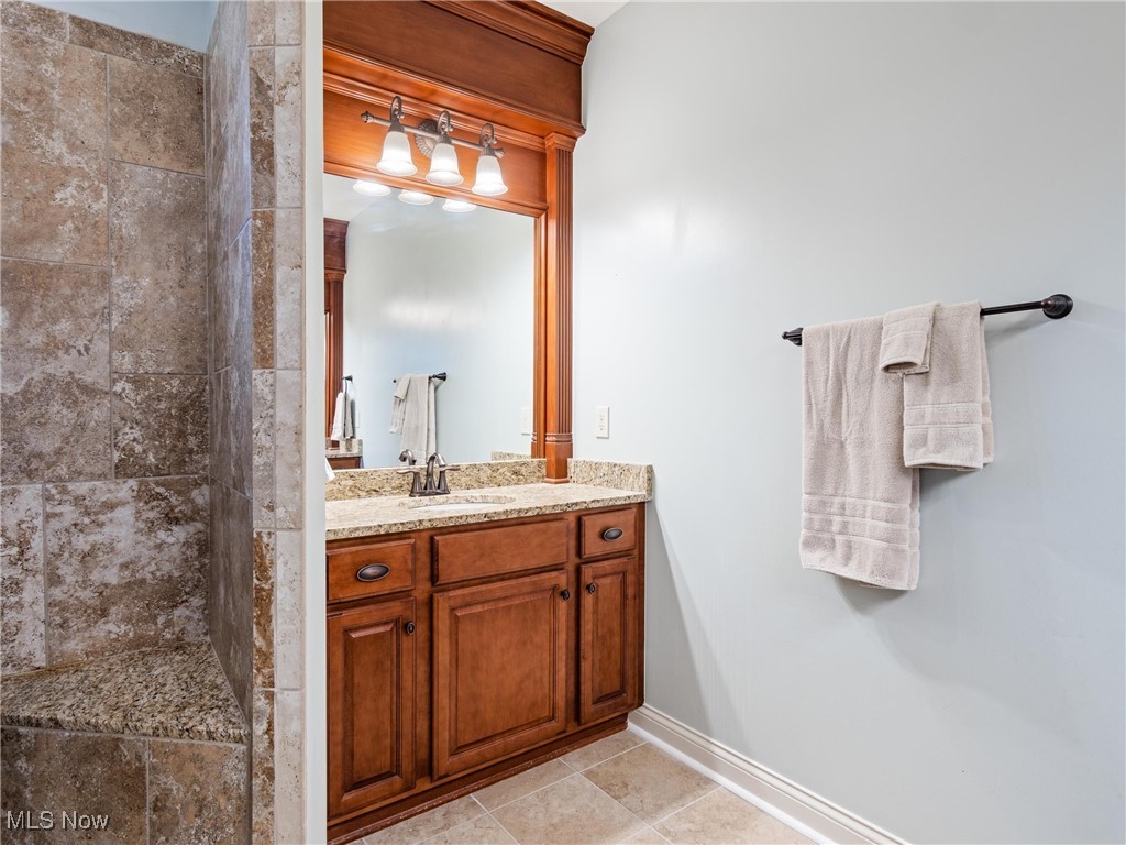 5349 Slater Ridge Westerville, OH 43082 - Photo 26 of 50 Full bath featuring vanity, a stall shower, and light tile patterned flooring
