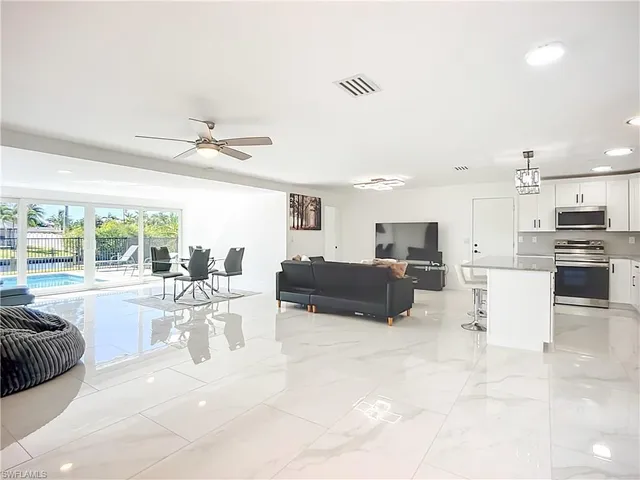 a view of a kitchen with furniture and a window