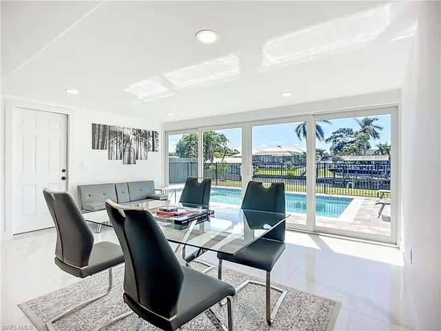 a workspace with table chair and window