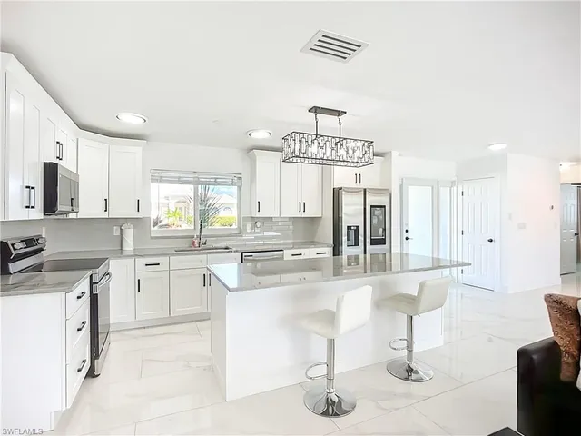 a large kitchen with cabinets