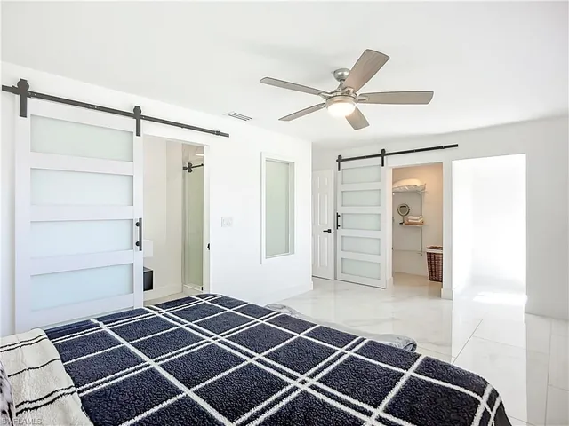 a room with wooden floor and white walls