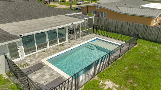 a view of a backyard with a deck and wooden floor