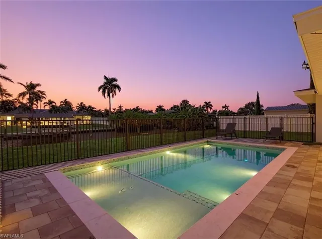 a view of a swimming pool with a lounge chairs