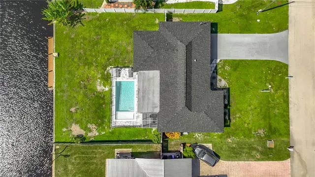 an aerial view of a house with a garden