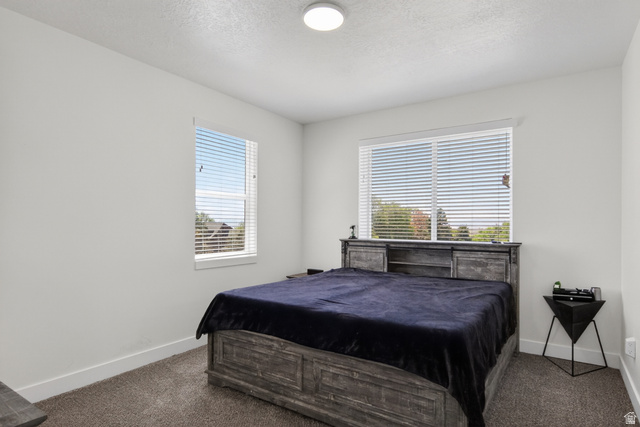 2811 South Orch Hl Lane Perry, UT 84302 - Photo 10 of 18 Primary bedroom with a walk in closet an ensuite bathroom with incredible views