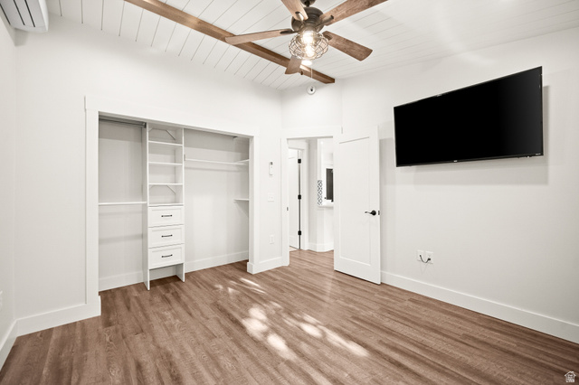 236 West 300 South Hurricane, UT 84737 - Photo 56 of 76 Spacious room featuring wood-finish flooring and a white shiplap ceiling with exposed wood beams