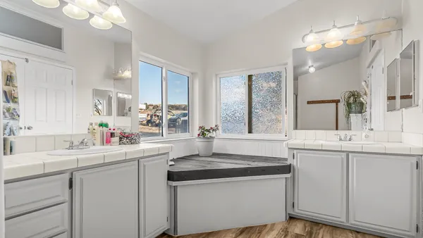 a kitchen with a sink stove and cabinets