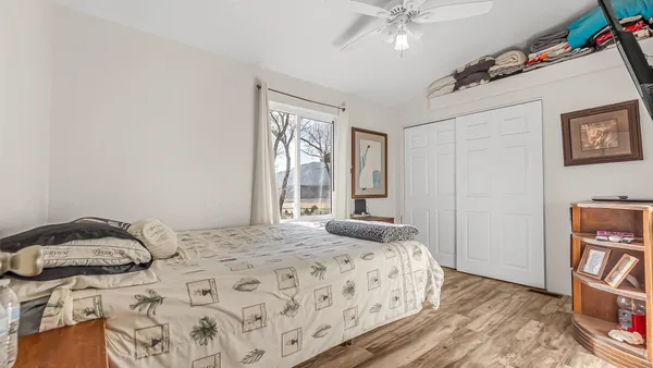 a bedroom with a bed and a window