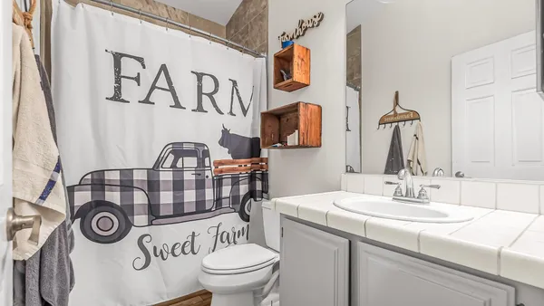 a bathroom with a toilet and a sink