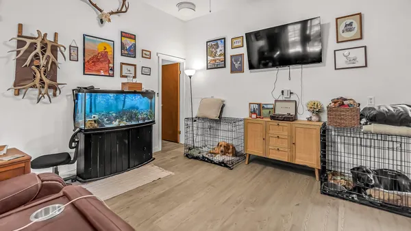 a living room with furniture and flat screen tv