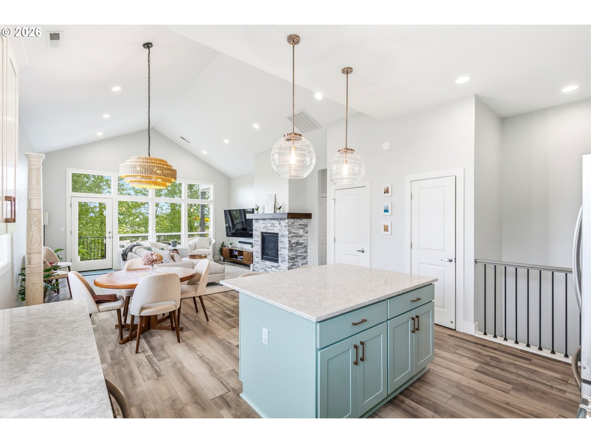 1372 Overview Street Northwest Salem, OR 97304 - Photo 16 of 45 a open kitchen with a refrigerator a sink dishwasher a dining table and chairs with wooden floor